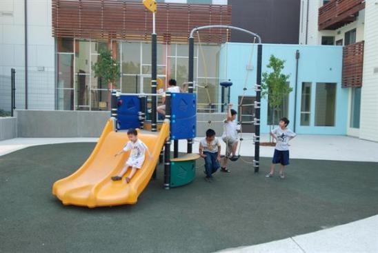 A courtyard playground caters to the many families that live in the community.