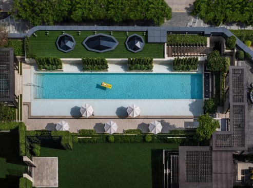 Outdoor Pool Deck and Roof Garden Feature Echoing the Architectural Language