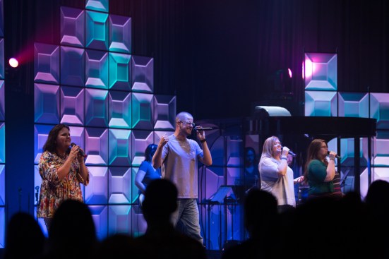 The wall in the main sanctuary was made of black T-bar grid hung vertically with Ceilume’s Convex style translucent panels, backlit by a color LED lighting system. Alternating panels were inverted to catch the light differently and vary the shadow effects in the wall. 