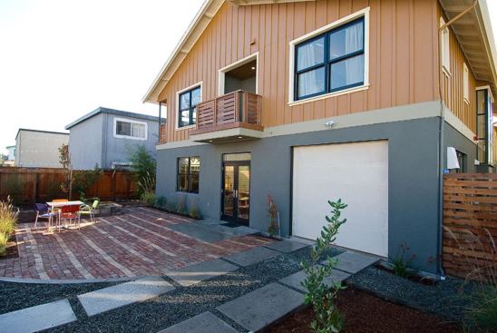 The backyards feature permeable pavers and native landscaping; home exteriors include CertainTeed's WeatherBoards fiber-cement siding.