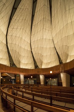 View of the main seating area with custom bronze floor lamps designed by the lighting designer.