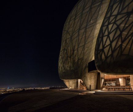 The entrance to the building at night.