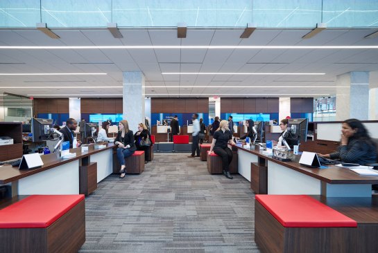 The new lighting strategy provides uniform illumination at the customer service desks, which are located under the mezzanine and extend into the double-height banking hall.