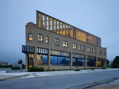South elevation. At early dusk the building begins to glow.