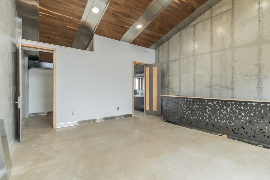 Master Suite with PA black walnut ceiling, pebble design laser cut steel balustrade