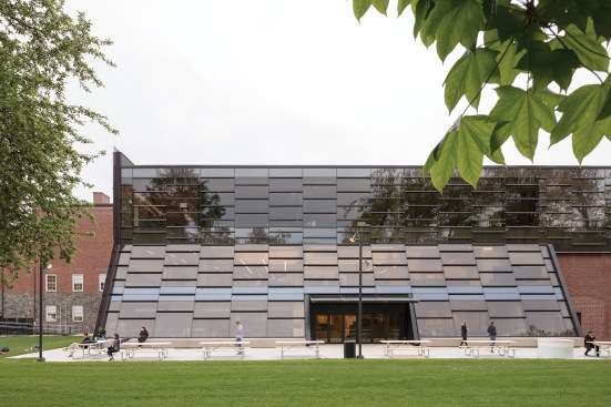 On the new north façade, a sloping glass curtainwall—its chevron profile determined by the addition of a third floor—admits diffuse light to the interior and preserves the view of an adjacent cemetery.