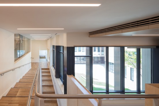 A series of ramps wrap the courtyard to connect the new construction to existing and renovated spaces in the surrounding buildings. With the addition of the ramps, students and faculty can navigate the entire complex without needing to go outdoors.