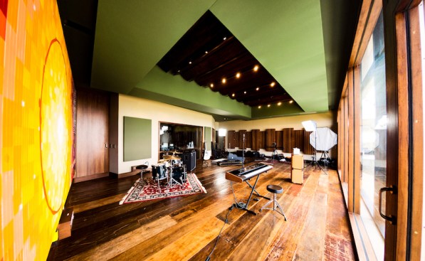 750 sq. ft. Live Room features a 20’ ceiling height, panoramic mountain views, and a striking ‘Sunburst’ studio logo hand painted over an acoustical broadband wall treatment.