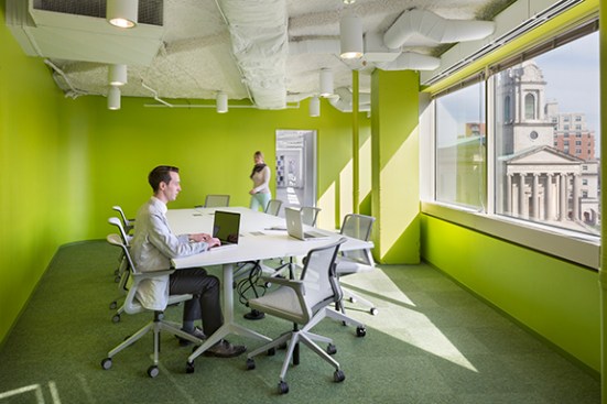 Five new vivid green conference rooms were integrated into the space, recapturing views of Thomas Circle that had previously been obscured by private offices.