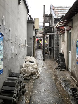 Building materials await renovations, Dongcheng district, Beijing, 2017.
