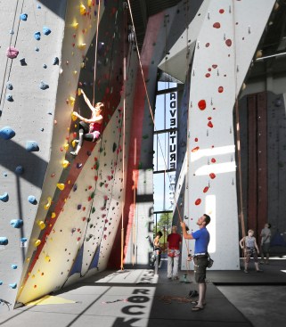 The Adventure Rock climbing gym encompasses 17,800 square feet, and rises the full four floors of the building.
