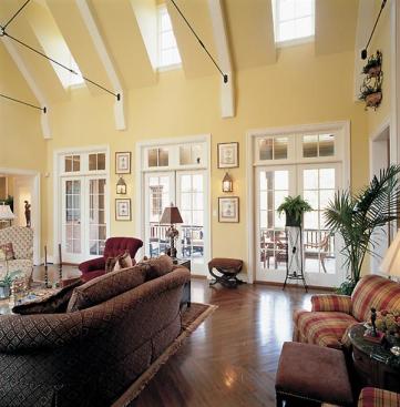 A kinder, gentler massing makes this prototype production house a modest addition to its McMansion neighborhood. Dormers funnel extra light into interiors, and a screened porch adds sheltered outdoor living space.