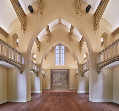 Surface and object accent fosters a vibrant space for gathering and pondering. Two motorized spotlights allow for flexible key lighting of speakers.