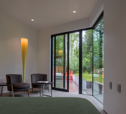 Guest suite with view to yard beyond.