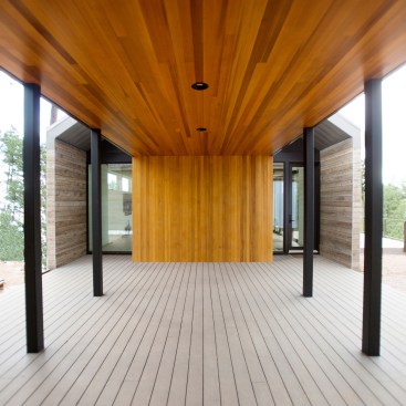 Tomecek Studio employed modular design and prefabrication to expedite construction of the main residence of the Black Hills Homestead, which is connected to a barn via a vertical-grain cedar breezeway.