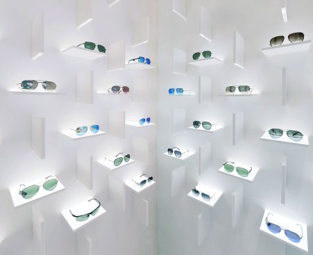 A system of vertical and horizontal "fins" form the sculptural setting to showcase the eyewear.