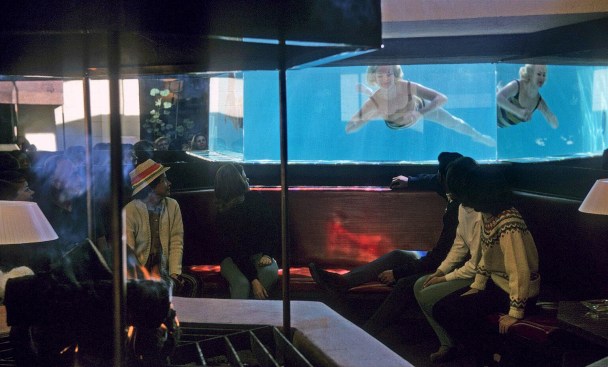 Boomerang Lodge, circa early 1960s. Charles Paterson (black hair) is shown looking into pool.