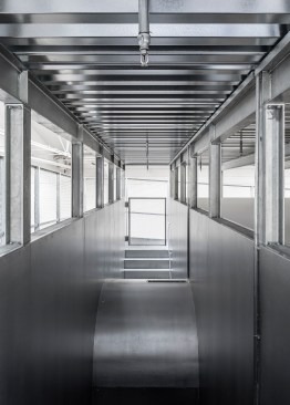 Top of stair, with circular window surround in foreground