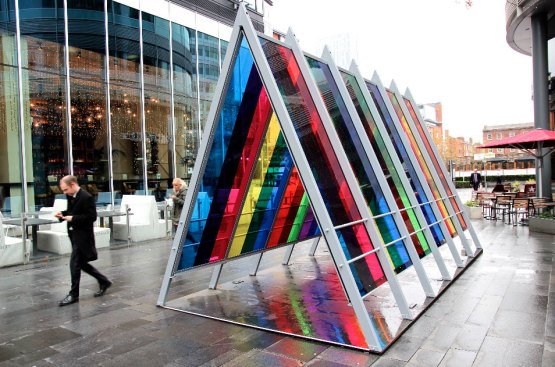 During the day, natural lighting conditions dictate the appearance of the artwork.