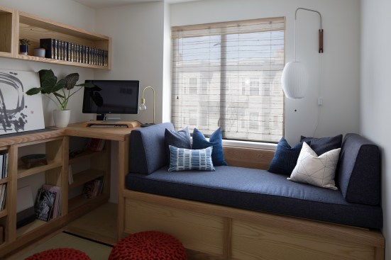 his 100-square-foot room features custom ash wood library shelving, a standing desk nook, and a daybed-topped trunk that can be assembled like puzzle pieces.