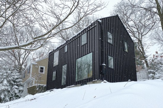 CO-G’s reimagination of the 1940s catalog Brookline House includes introducing dark modern cladding and axial windows to define interior spaces.