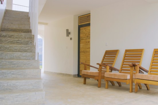 Louvers in the transom over each bedroom door keep the air moving, which can limit the spread of infection to immunocompromised patients, even without mechanical systems.