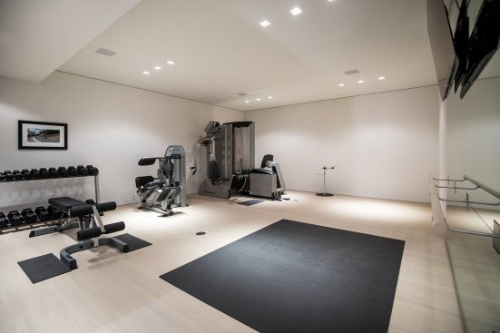 Luxury home gym at Beverly Hills mansion.