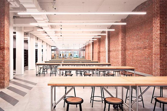 Open work spaces with segregated dirty making wood and metal shop beyond.