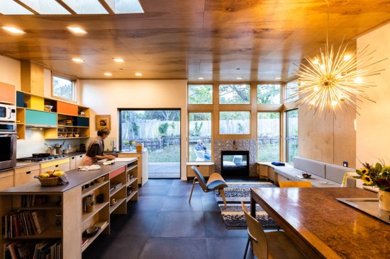 The new, open living space has seating and dining areas, and a new spacious kitchen.