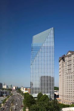 Located on a prominent corner in Atlanta, this tower is a monumental glass volume chiseled on the diagonal to create a bold V-shaped form that reveals the inner volume and a translucent, triangular crown.
