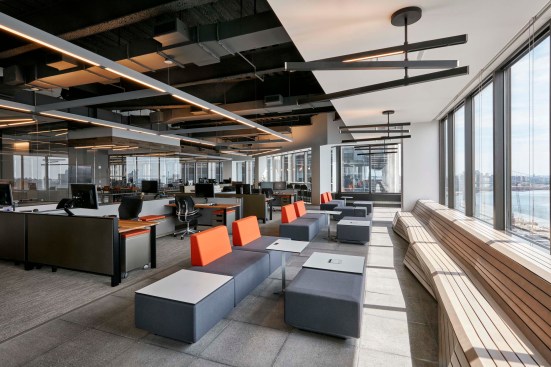 The perimeter bench system was custom designed and fabricated. The undulating lines/form of the benches are a reflection of the East River’s currents, which are in clear view from the office. The wood planks/material is a nod to the mercantile piers and boardwalks. 