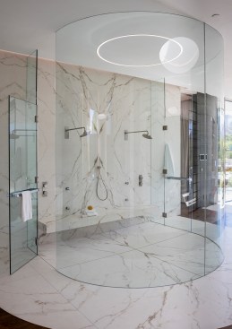 Serenity Indian Wells luxury desert home modern circular shower with marble & glass walls