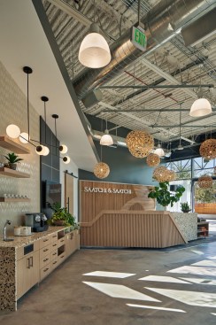 All are welcomed by their bespoke reception desk surrounded by layers of light and texture.