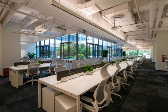 Windows onto the atrium provide views and a visual connection to other employees around the building