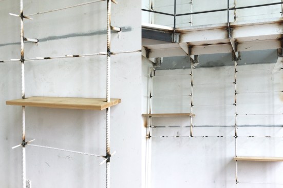 solid white ash planks slotted onto shelving unit