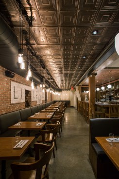 The lightweight ceiling tiles were glued directly to the ceiling drywall, making them far easier to install than stamped metal tiles.