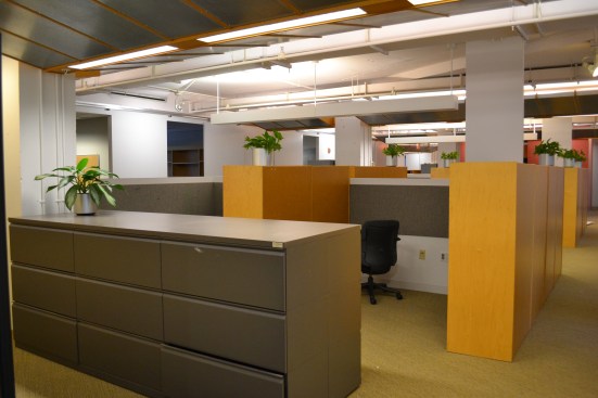 High cubicle walls divided the space and prevented collaboration.