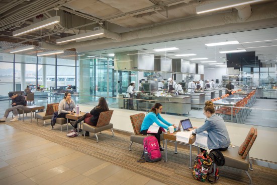 The interior of the building includes classrooms, computer labs, a teaching kitchen, cafe, professional golf management program simulation labs, learning studios, specialty classrooms, offices and administration areas. 