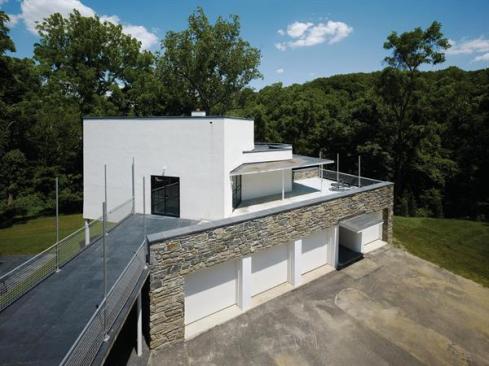 The new bridge and restored studio, viewed from the house.