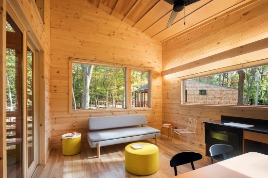 Marvin Windows and Doors bring nature and daylight into the cabin interiors, such as this living area in a two-bedroom unit.