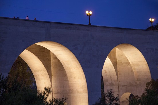 The lighting design highlights the bridge's interior arches giving form to the structure at night.