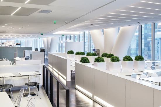 The employee dining space is lit with recessed lighting from Philips.