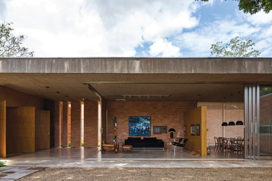 There is no traditional front door at Casa BLM. Instead, visitors enter through the living room, whose sliding glass wall is regularly left open. A continuous concrete slab caps the structure, providing a stong horizontal datum line.