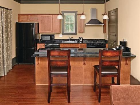 Kitchen

Each unit contains a full kitchen with Whirlpool stainless steel Energy Star appliances, a Kohler Coralais ADA-compliant 2.2-gpm pull-out faucet, and accessible-height granite countertops. Whirlpool: 866.698.2538. www.whirlpool.com. Kohler: 800.456.4537. www.kohler.com.