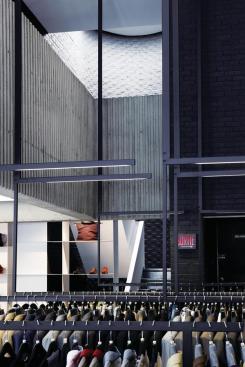 Hanging clothes racks looking toward oculus.