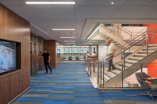 The new open stair allows for an airy and direct connection between building wings and provides an attractive alternative to elevator use. Haworth Enclose architectural wall systems were used throughout the open offices.