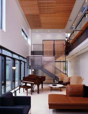 Architect: 
DeStefano and Partners, Chicago; 
Builder: Goldberg General Contracting, Chicago. The tall, narrow great room in this infill house is made more personal by a ceiling finished with finely detailed wood panels placed asymmetrically in different directions. 
Read more about the builder of this house and see more iamges of the project here.