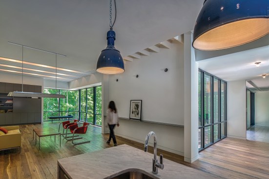 Interior spaces are open and fluid, shifting perspectives throughout the house as the inhabitants move from the “public” volume of living, dining, and kitchen areas to the private volume of bedrooms and baths, all on one floor.