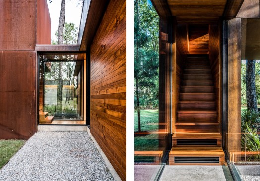 A short glass hallway connects the “treehouse” to the main house.