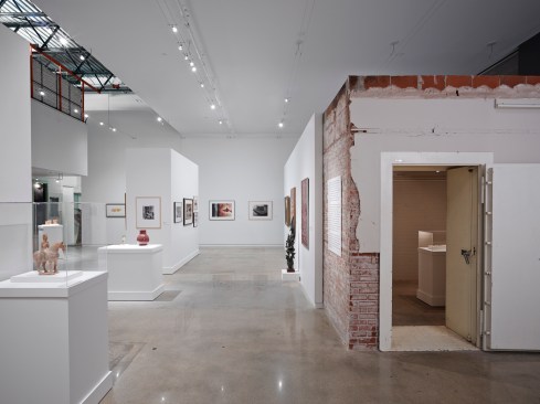 Gallery+B+looking+west+with+the+existing+vault+in+the+foreground.++The+1960s+mezzanine+is+visible+in+the+upper+left.+An+exhibition+is+being+installed.